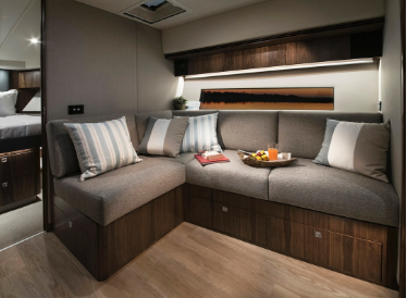 Picture of yacht interior living space with custom cabinetry design and upholstery work.