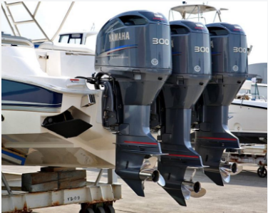 Picture of three 300 horsepower Yamaha outboard engines following a tune up at a boat yard in Miami.